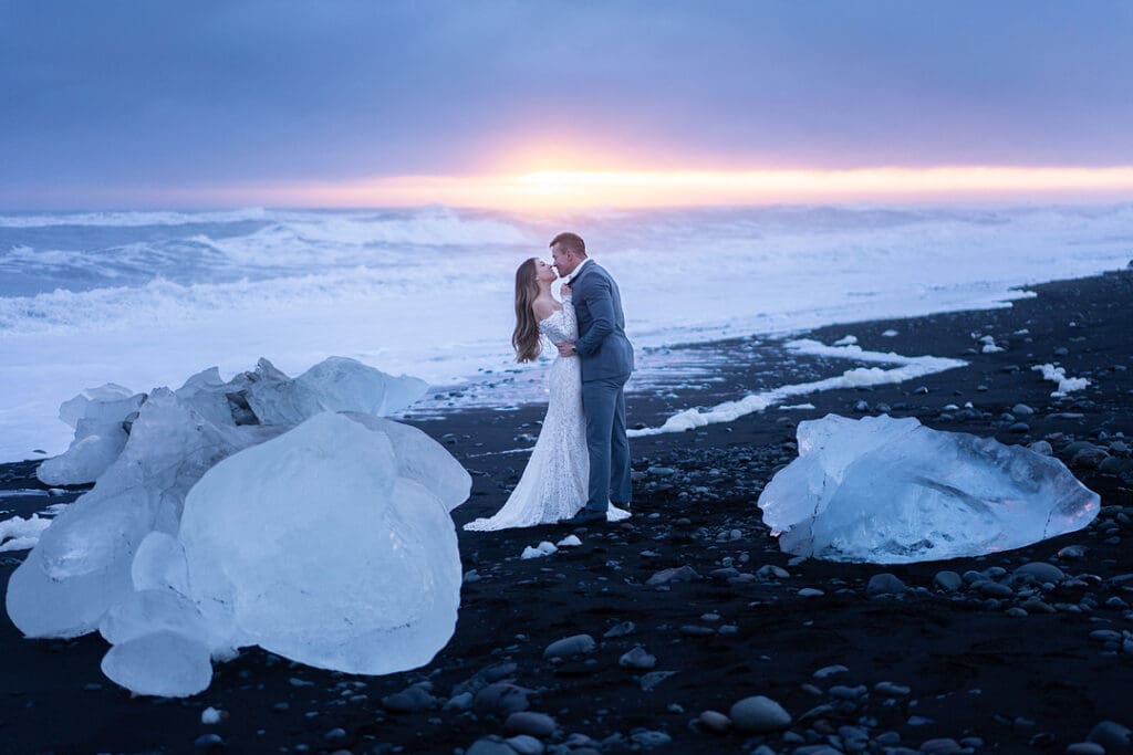 Sunset elopement among ice chunks at Diamond Beach in Iceland