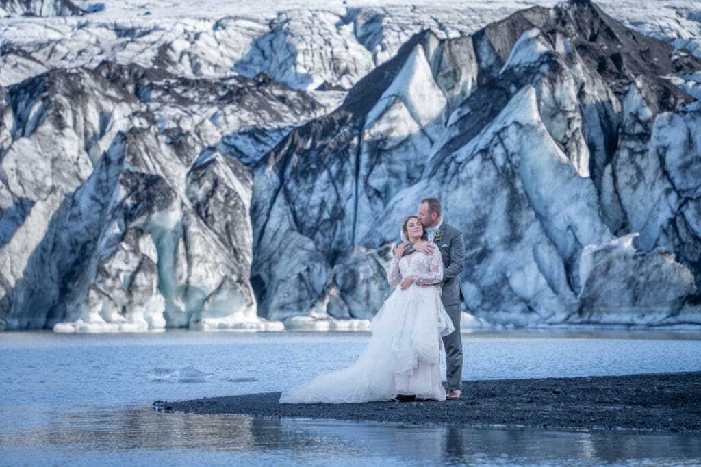 Bride and groom in front of Solheimajokull glacier in Iceland