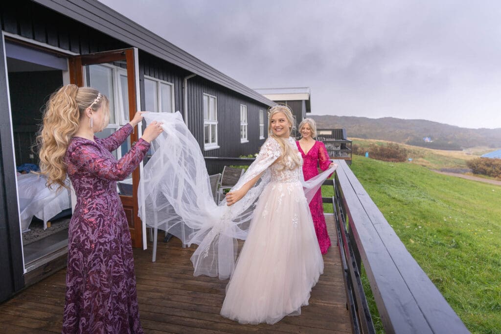 A bride's family is helping her get ready for her micro wedding