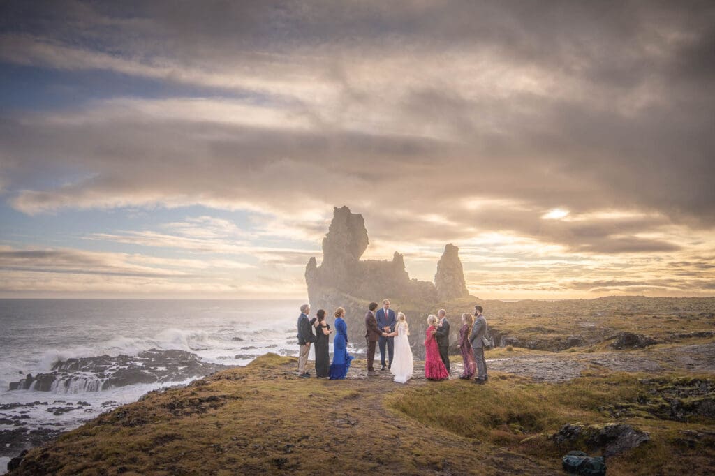Micro wedding ceremony by the ocean at sunset in Snaefellsnes Peninsula
